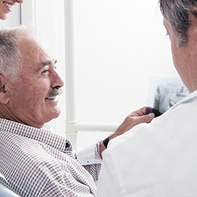 older man smiling at x-ray