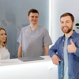 a patient paying for their dental crown