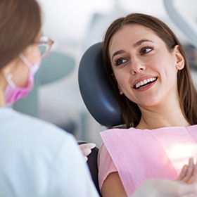 woman talking to dentist