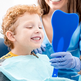 boy smiling in mirror