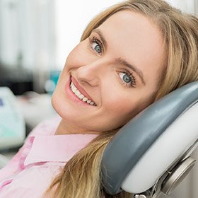 woman in pink smiling