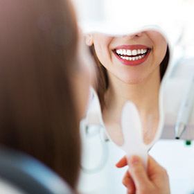 woman's smile in mirror