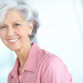 a patient with dentures smiling confidently