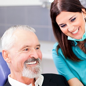 assistant showing patient a chart