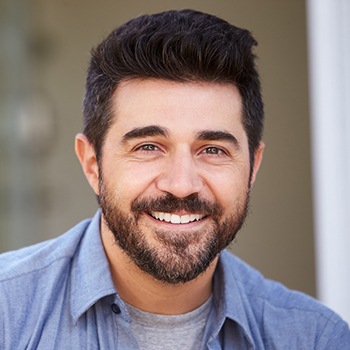 man with beard and mustache smiling