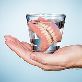 dentures in glass of water