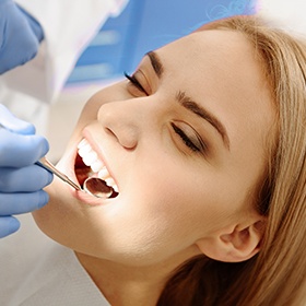 woman getting checked for gum disease