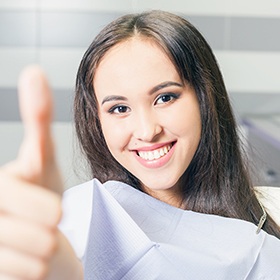 woman giving thumbs up