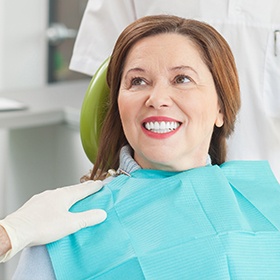 woman wearing turtleneck smiling