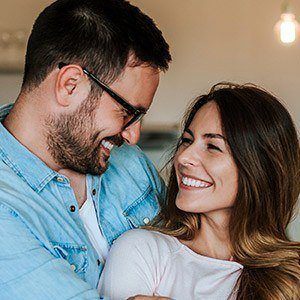 man and woman smiling at each other