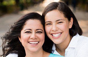 mother and daughter smiling