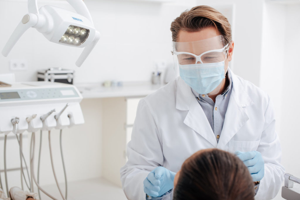 Dentist in Lawrenceville uses protective equipment.