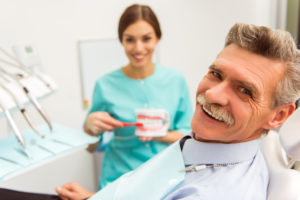 Older man smiling at dentist's office