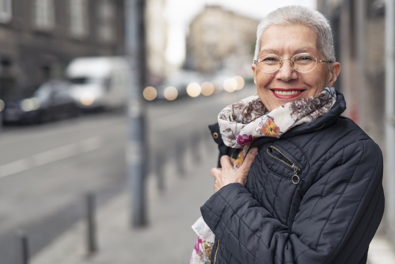 Woman smiling with dental implants in Lawrenceville