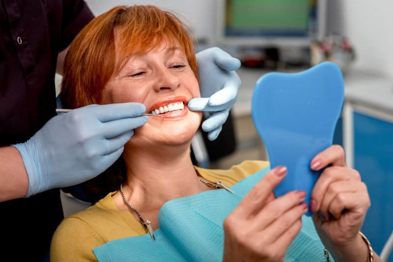 Woman smiling with dental implants