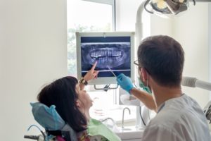 woman talking to dentist in Lawrenceville