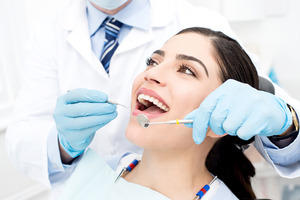 Female patient receiving a dental checkup