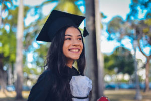 Young female in graduation cap and gown