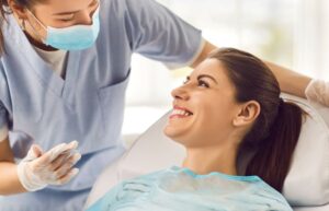 Patient smiling at dental team member