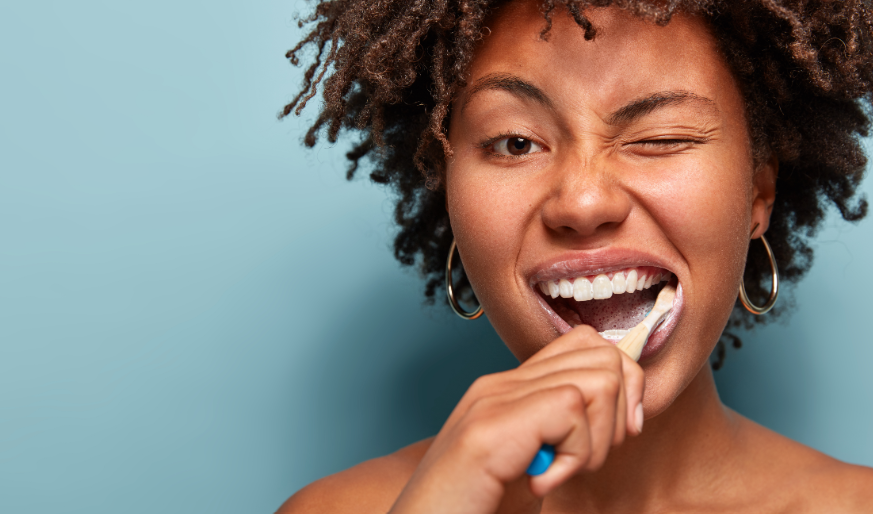 Woman brushing teeth